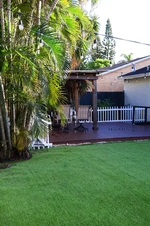 a view of an house with backyard porch and sitting area