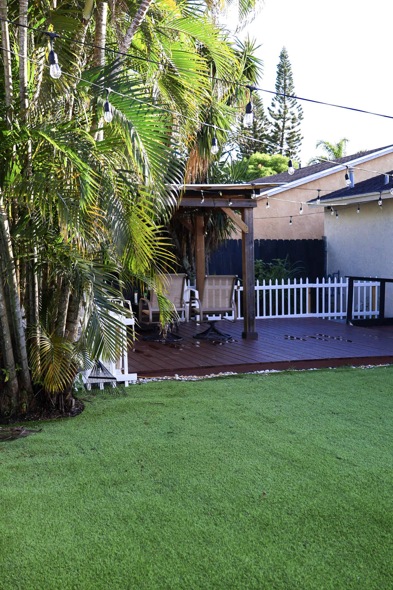 5905 Triphammer Road Lake Worth, FL 33463 - Photo 15 of 16 a view of an house with backyard porch and sitting area