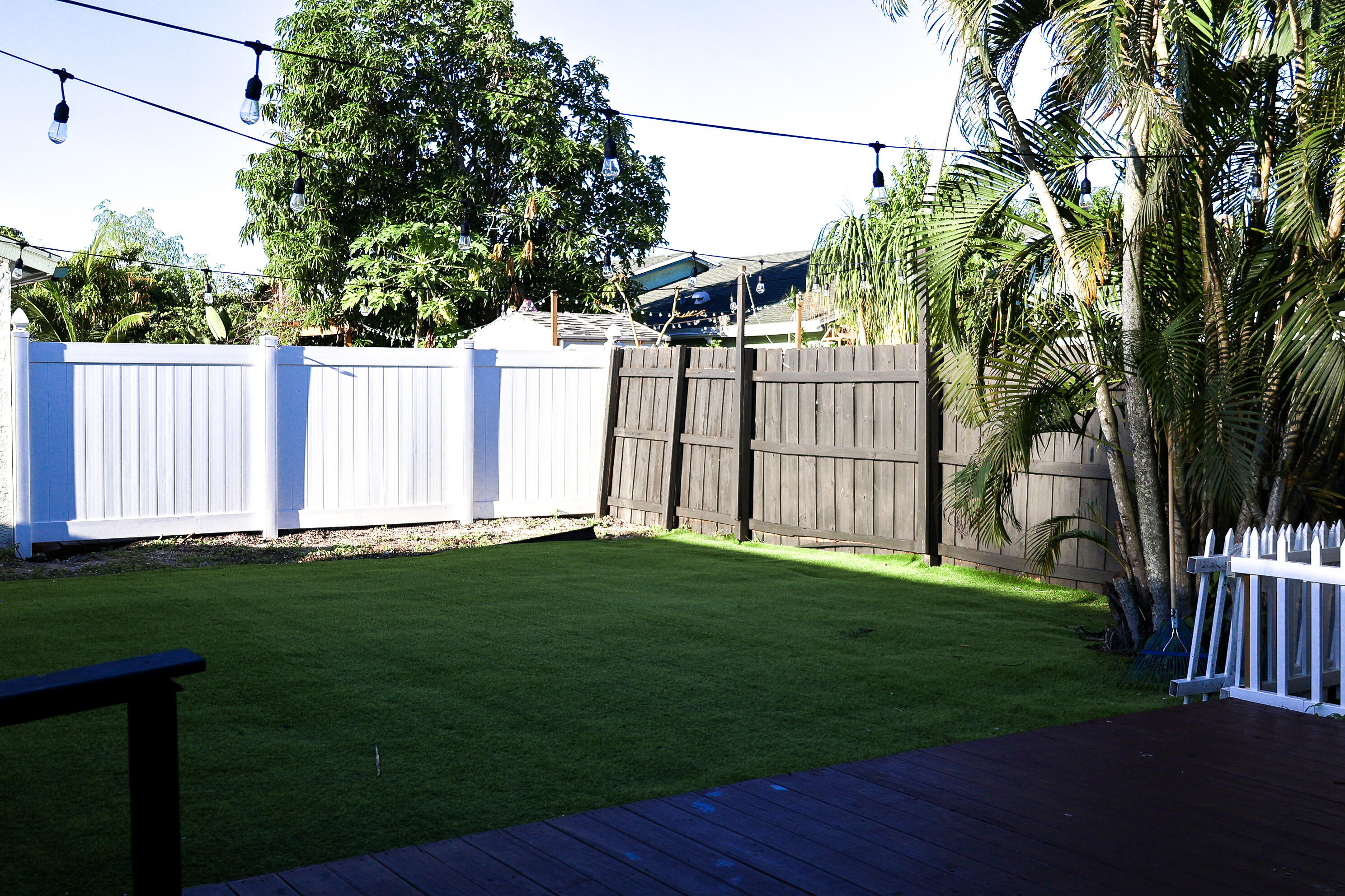 5905 Triphammer Road Lake Worth, FL 33463 - Photo 16 of 16 a view of a backyard with a garden