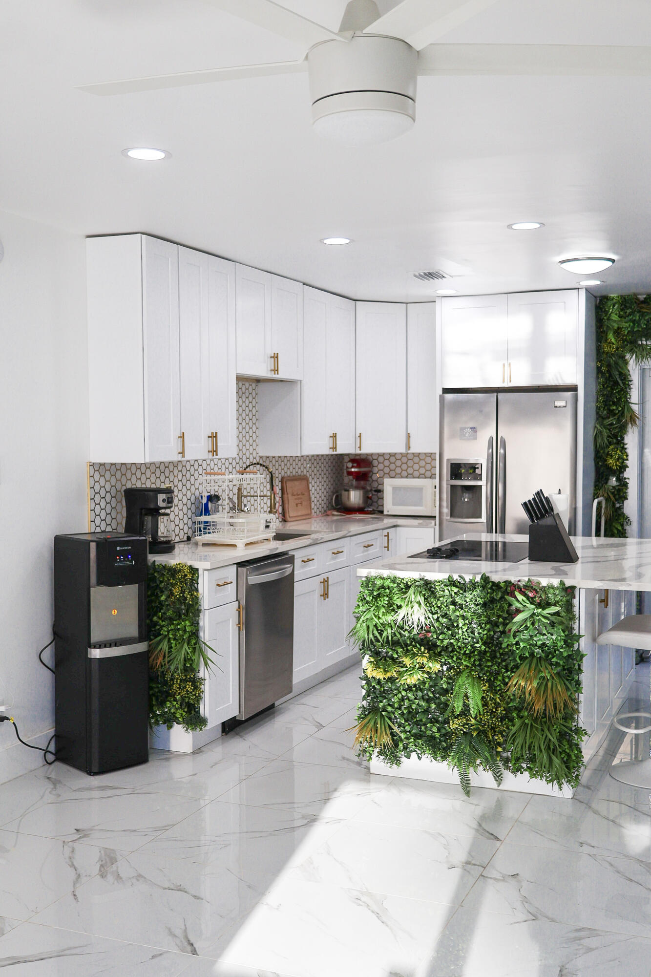 5905 Triphammer Road Lake Worth, FL 33463 - Photo 4 of 16 a kitchen with a cabinets a sink a counter and stainless steel appliances