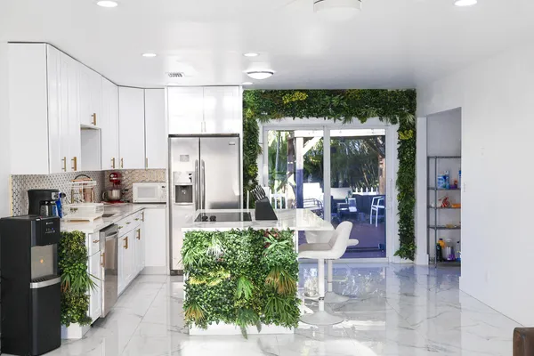 a kitchen with counter top space cabinets and stainless steel appliances