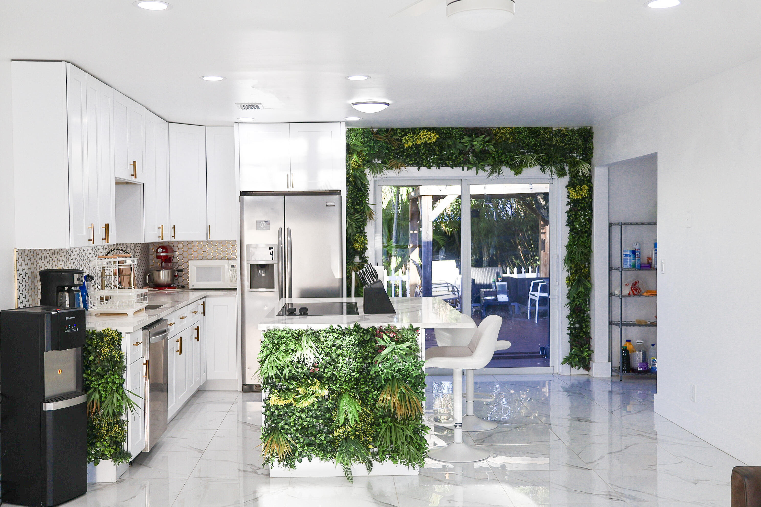 5905 Triphammer Road Lake Worth, FL 33463 - Photo 5 of 16 a kitchen with counter top space cabinets and stainless steel appliances