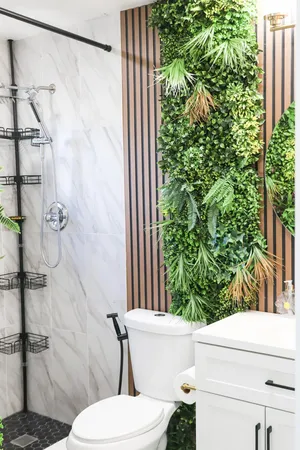 a white toilet sitting next to a shower curtain