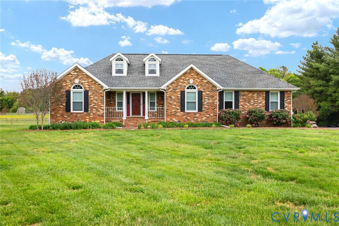 16379 Arch Hill Road Hanover, VA 23069 - Photo 1 of 26 a front view of a house with a garden