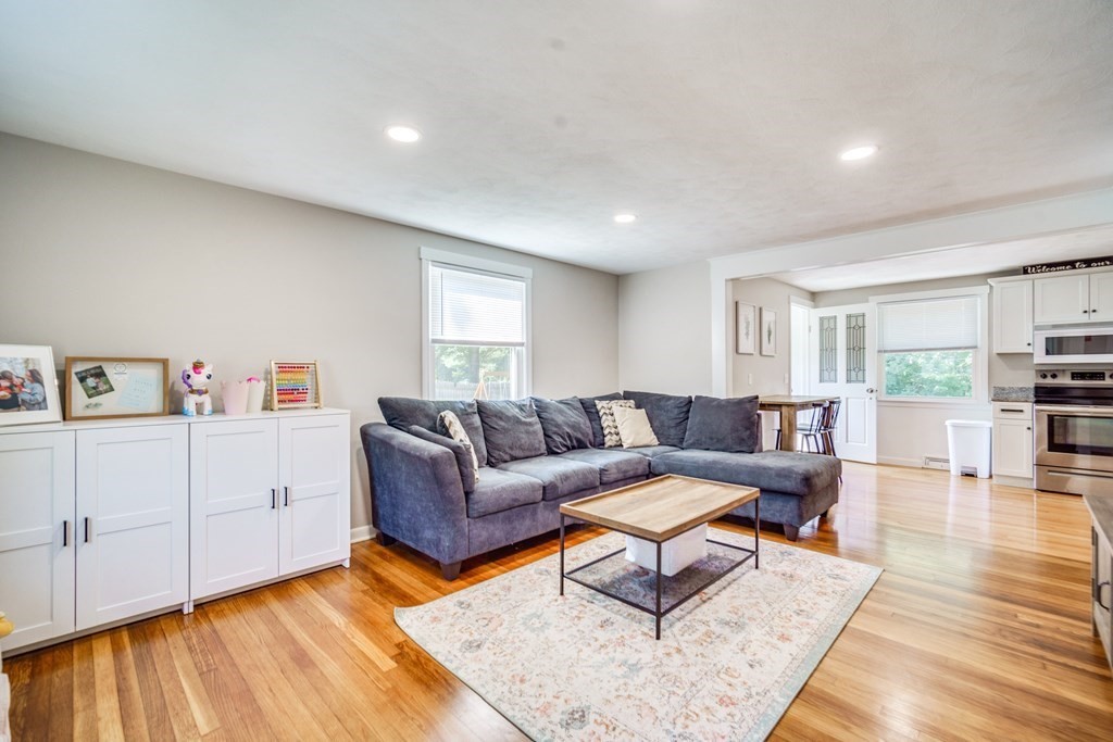 72 Wachusett Street Springfield, MA 01118 - Photo 13 of 28 a living room with furniture and a wooden floor