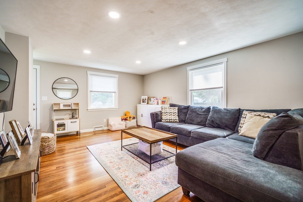 72 Wachusett Street Springfield, MA 01118 - Photo 15 of 28 a living room with furniture and a wooden floor