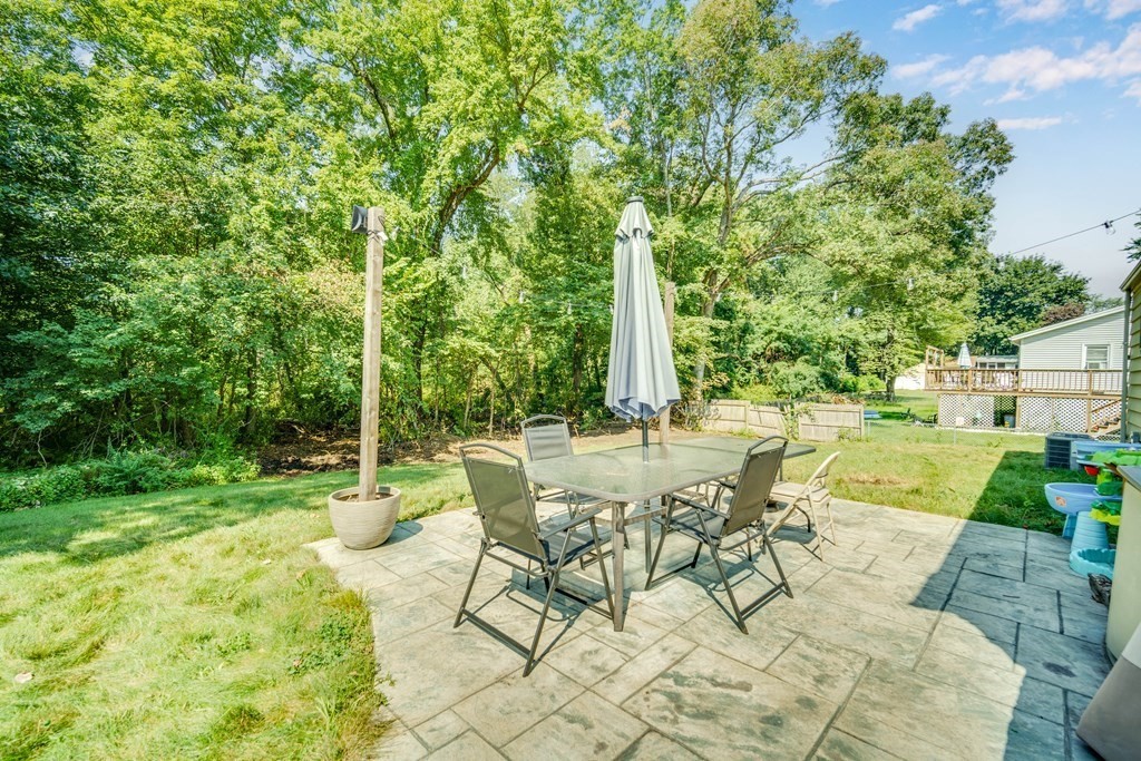 72 Wachusett Street Springfield, MA 01118 - Photo 27 of 28 a view of a yard with a table and chair