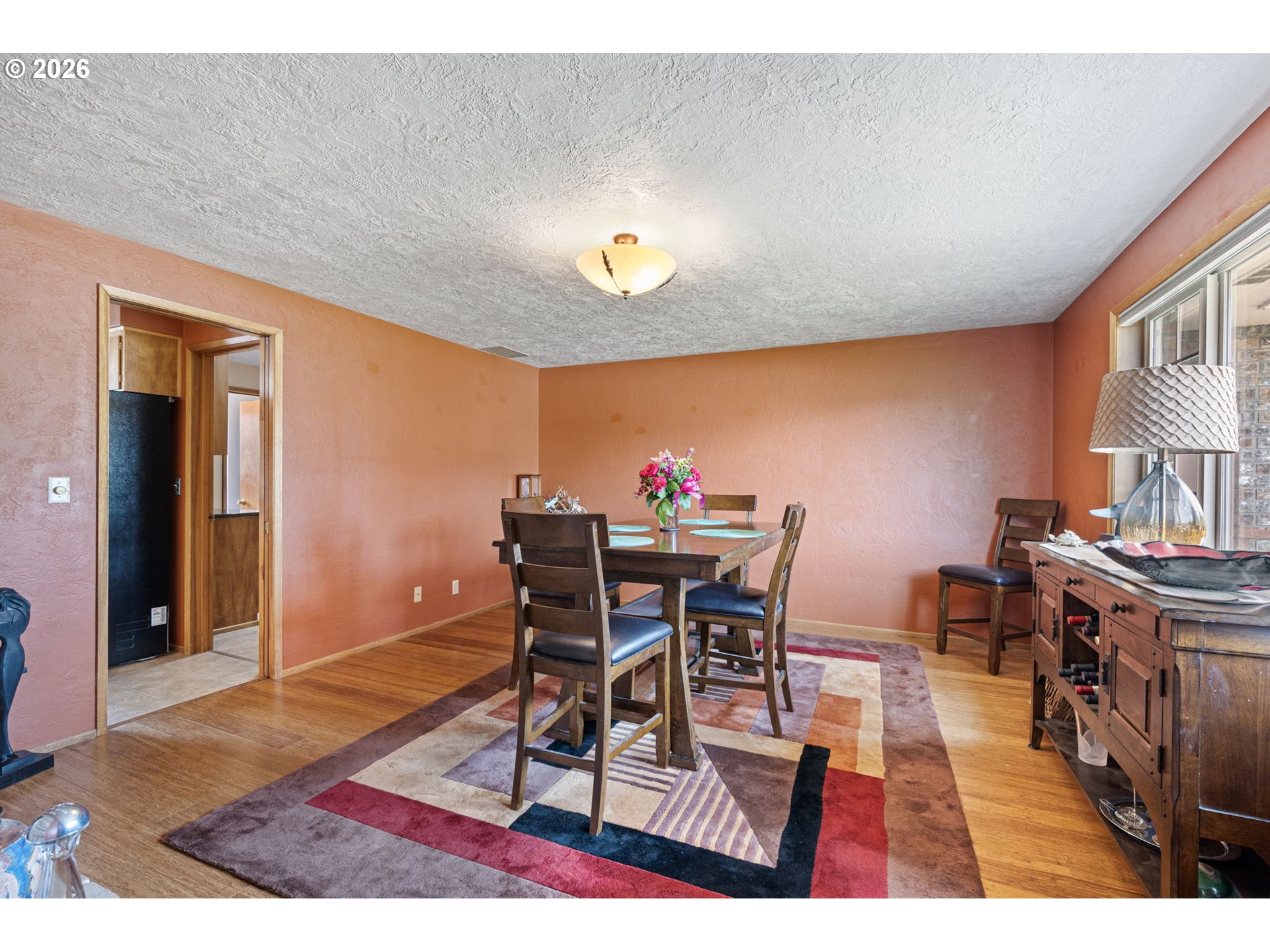 2465 17th Street Springfield, OR 97477 - Photo 19 of 47 a view of a dining room with furniture and chandelier