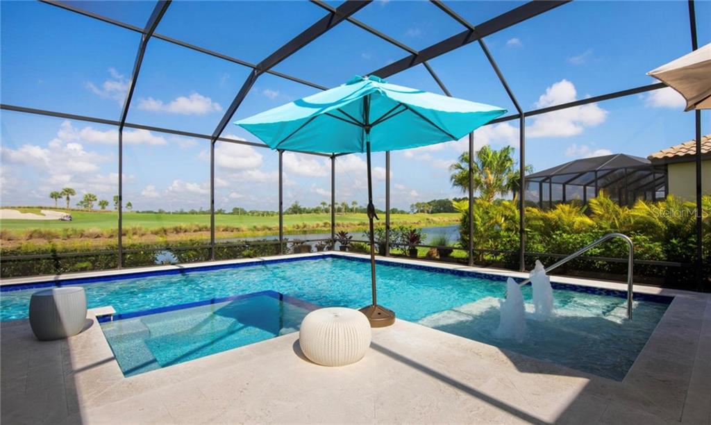 5543 Arnie Loop Bradenton, FL 34211 - Photo 15 of 45 a view of a swimming pool with a porch and furniture