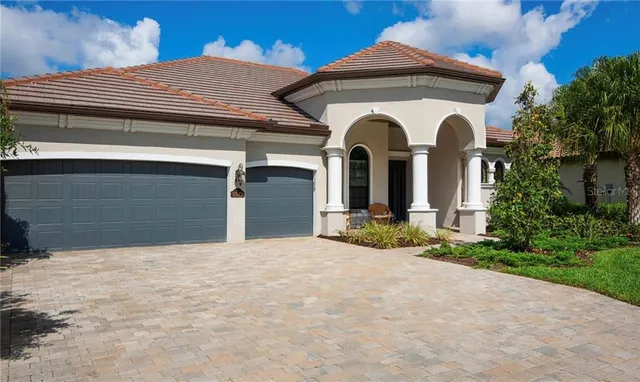 a view of a house with large windows