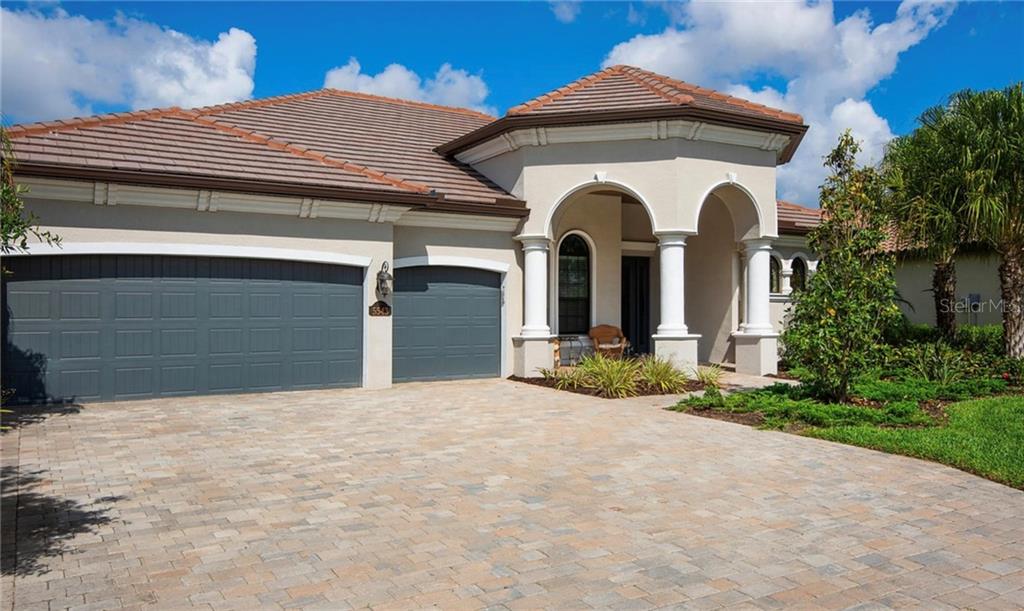 5543 Arnie Loop Bradenton, FL 34211 - Photo 2 of 45 a view of a house with large windows