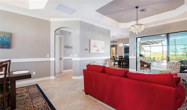 a front view of a house with a yard table and chairs