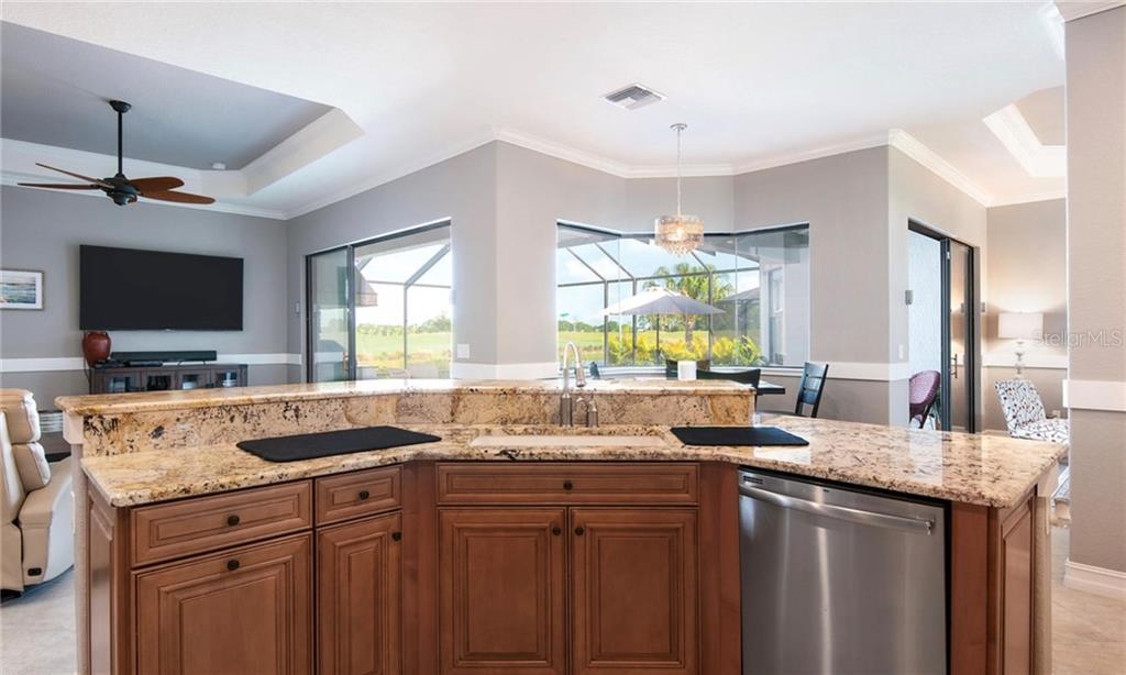 5543 Arnie Loop Bradenton, FL 34211 - Photo 38 of 45 a kitchen with a sink stove and microwave