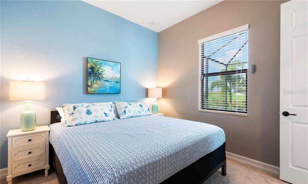 5543 Arnie Loop Bradenton, FL 34211 - Photo 39 of 45 a bedroom with a bed and a window