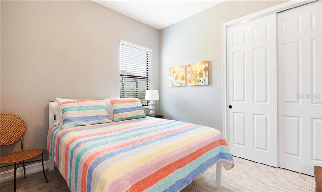 5543 Arnie Loop Bradenton, FL 34211 - Photo 41 of 45 a bedroom with a bed and a window