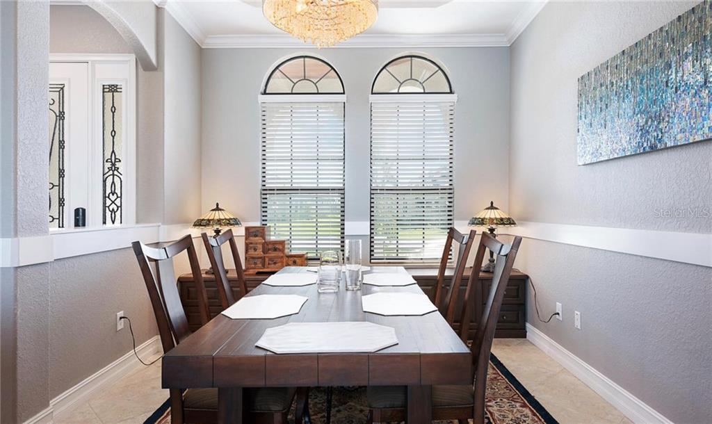5543 Arnie Loop Bradenton, FL 34211 - Photo 45 of 45 a view of a dining room with furniture window and wooden floor
