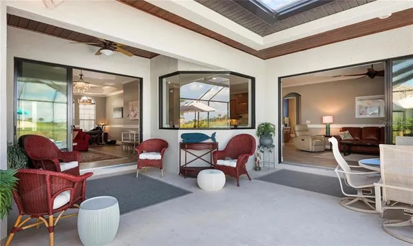 a living room with furniture a table and chairs