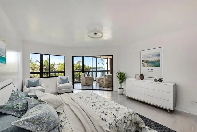 a view of a dining room with furniture wooden floor and a rug