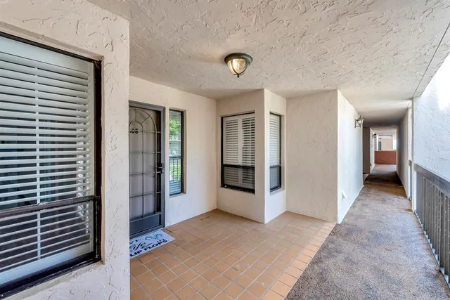 a view of a hallway with bathroom and bathroom