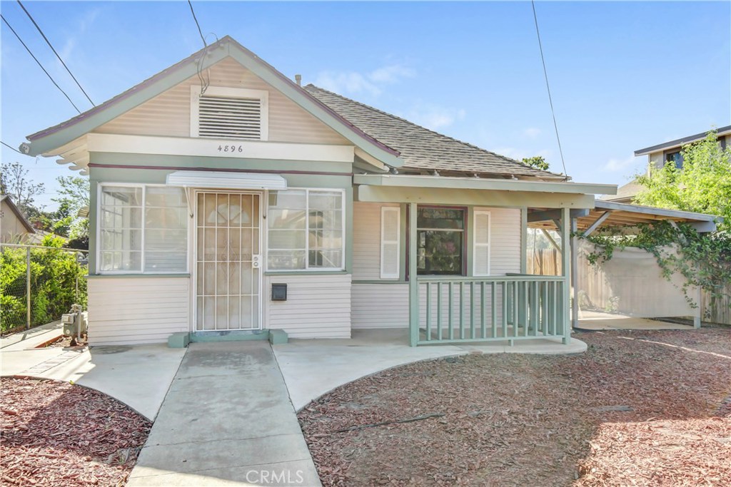 4896 Victoria Avenue Riverside, CA 92507 - Photo 1 of 1 a front view of a house with a porch