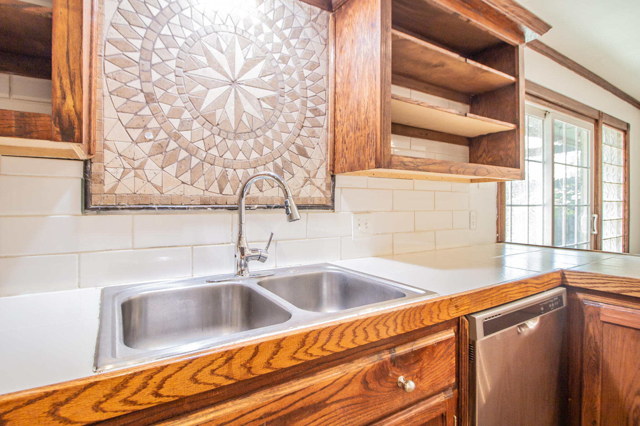 5503 9th Street Lubbock, TX 79416 - Photo 11 of 31 a close view of sink and tap
