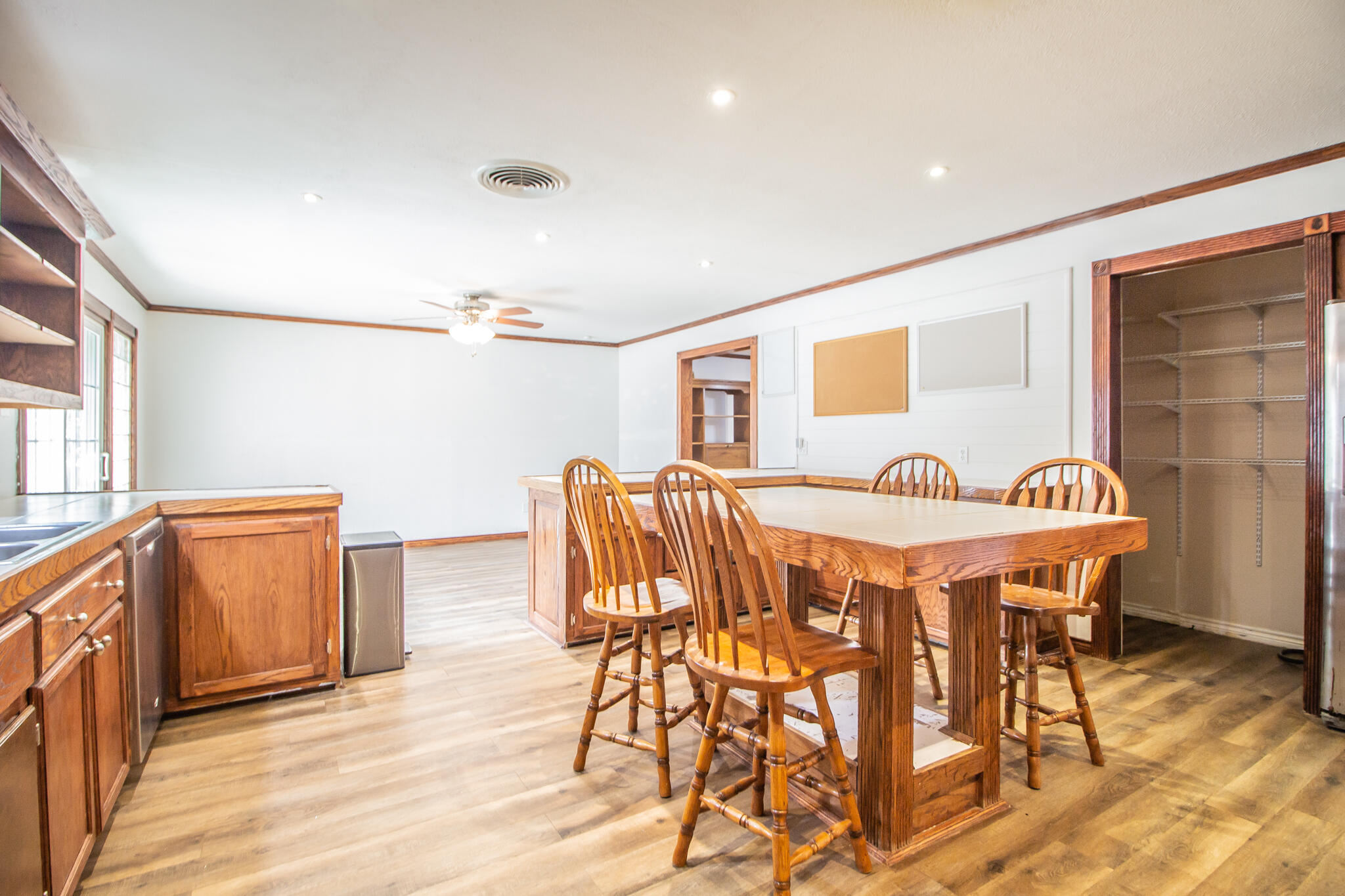 5503 9th Street Lubbock, TX 79416 - Photo 12 of 31 a view of a dining room with furniture and wooden floor