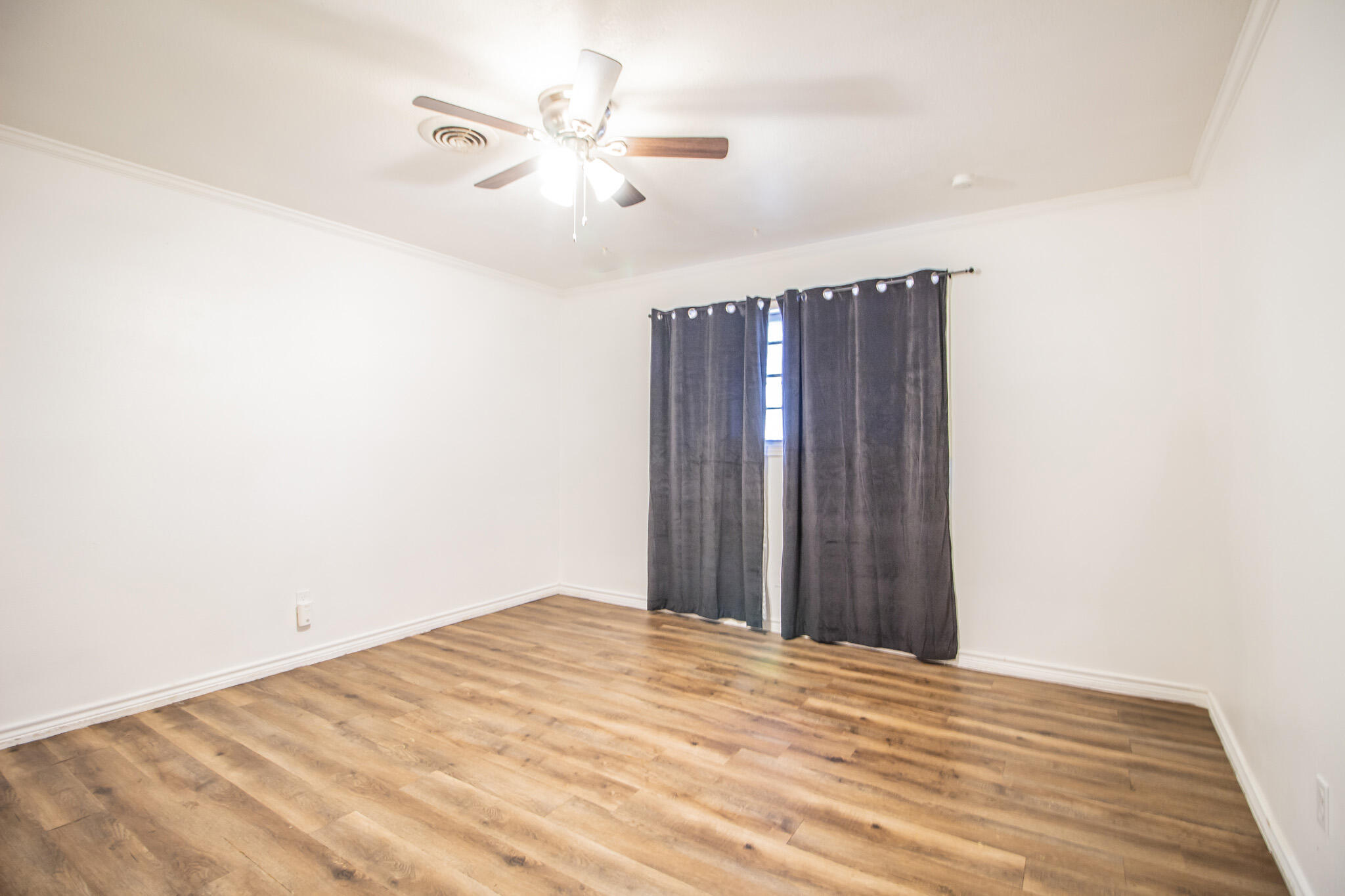 5503 9th Street Lubbock, TX 79416 - Photo 14 of 31 a view of a room with a ceiling fan