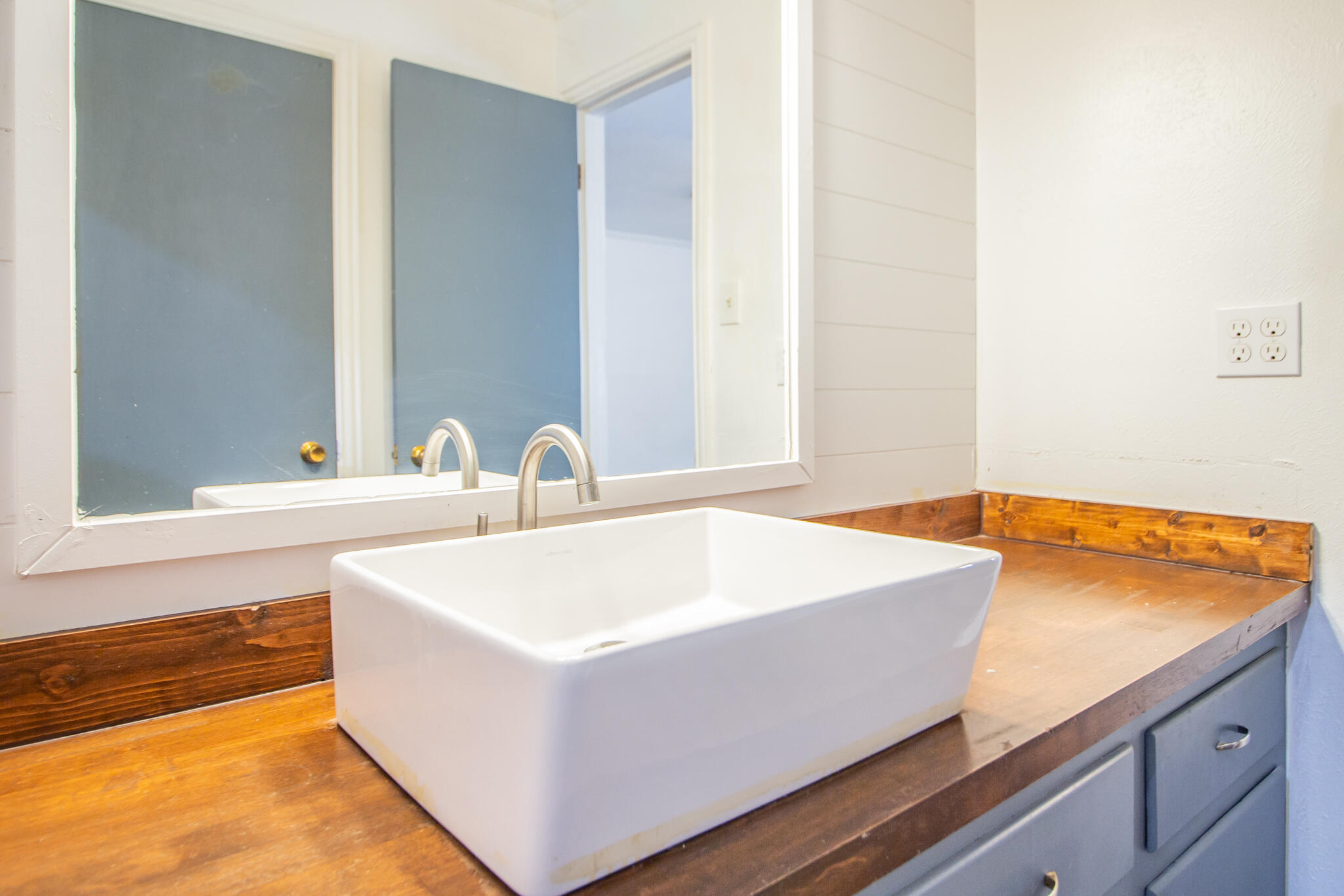 5503 9th Street Lubbock, TX 79416 - Photo 22 of 31 a white bath tub sitting in a bathroom