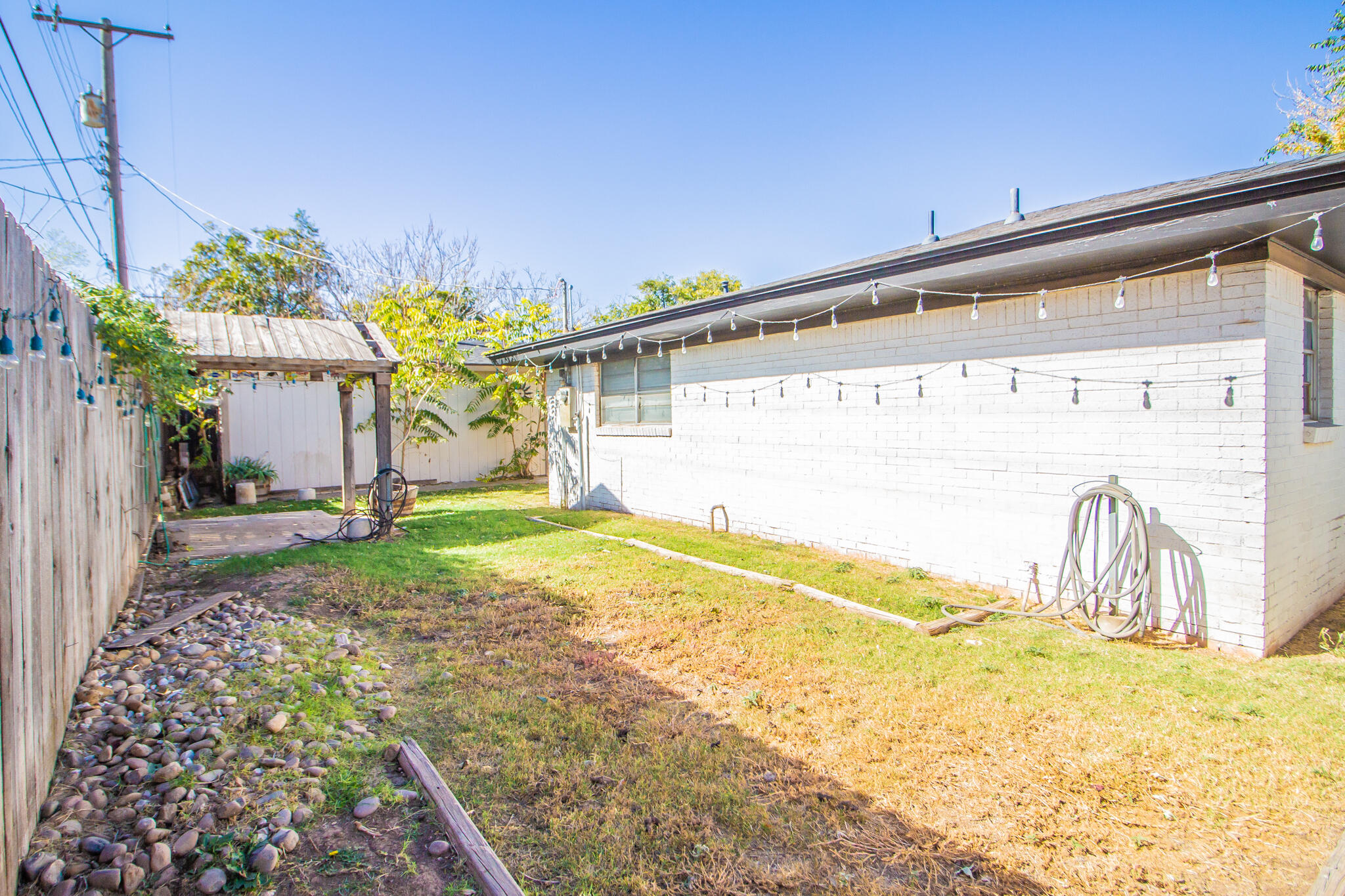 5503 9th Street Lubbock, TX 79416 - Photo 29 of 31 a bathroom with a sink and a mirror