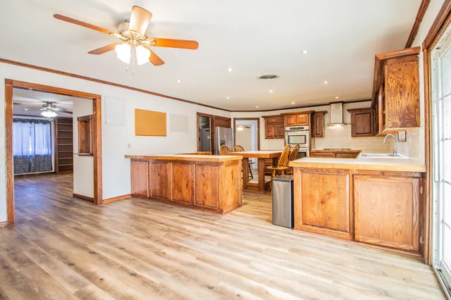 a view of a kitchen with furniture and a window