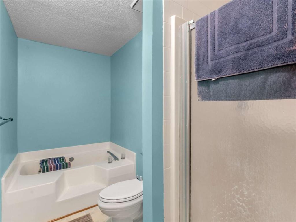 5 Ridgewood Circle McDonough, GA 30252 - Photo 15 of 20 a white toilet sitting next to a bathroom sink