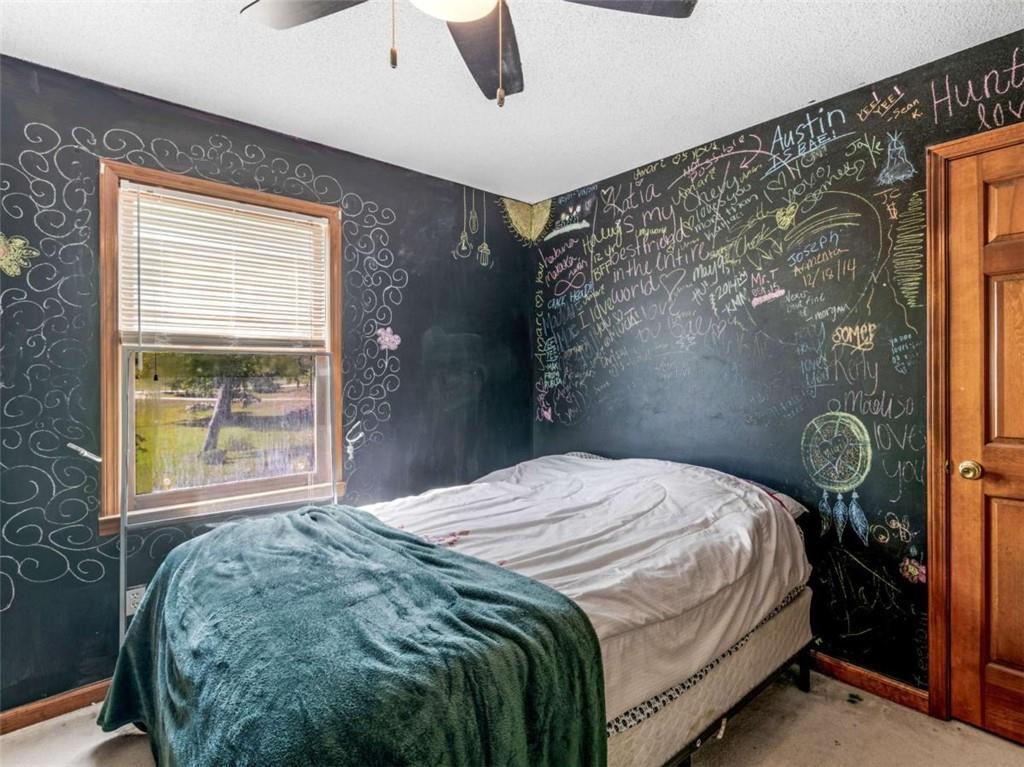 5 Ridgewood Circle McDonough, GA 30252 - Photo 16 of 20 a bedroom with a bed and a window