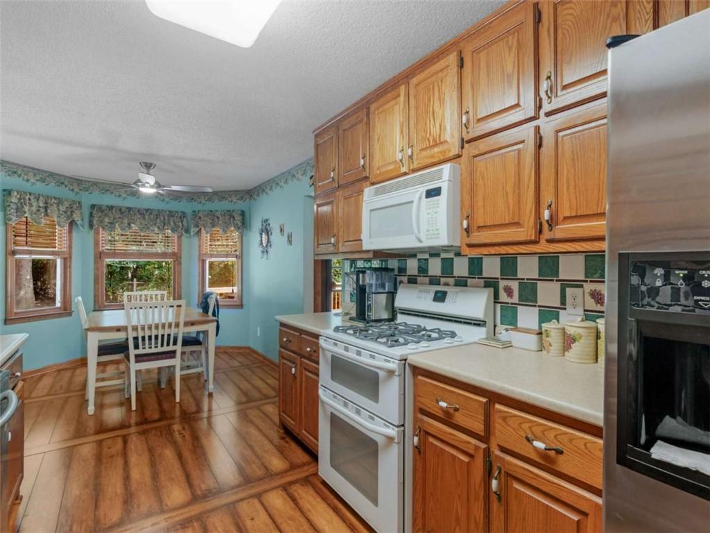 5 Ridgewood Circle McDonough, GA 30252 - Photo 9 of 20 a kitchen with stainless steel appliances granite countertop a stove and a sink