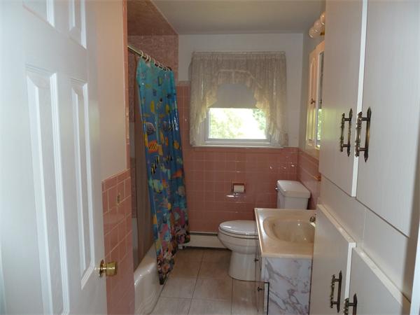 20 Fenwick Road Chelmsford, MA 01824 - Photo 7 of 15 a bathroom with a toilet and a shower
