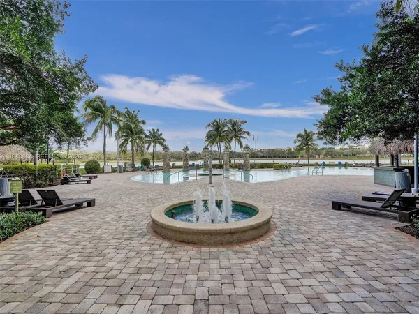 a view of a swimming pool with a table and chairs