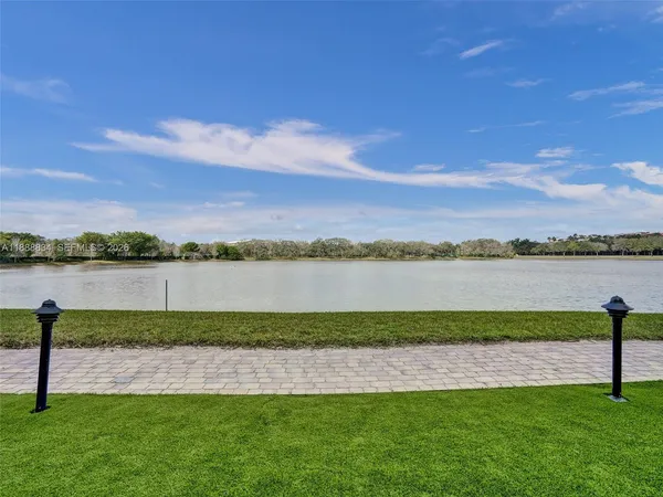 a view of a lake with a big yard