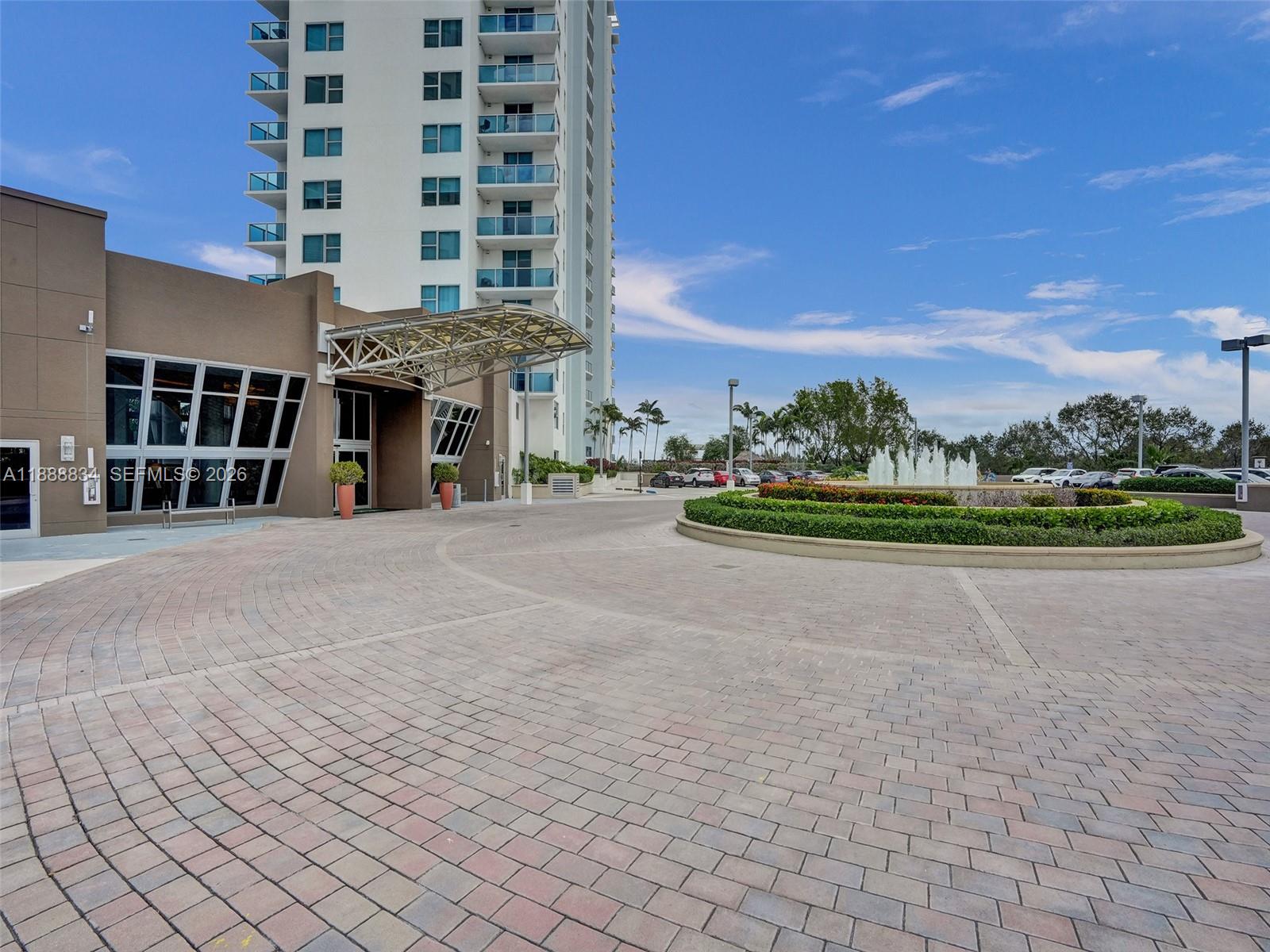 2681 North Flamingo Road, Unit 605S Sunrise, FL 33323 - Photo 31 of 47 a view of a building with a yard
