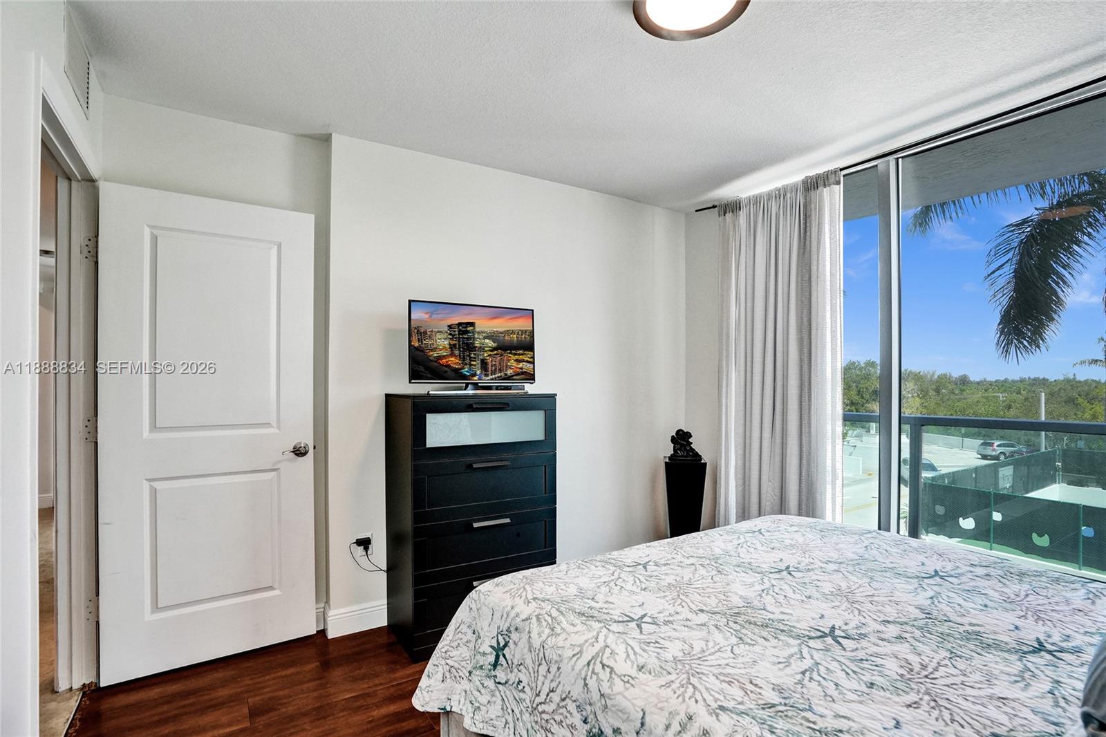 2681 North Flamingo Road, Unit 605S Sunrise, FL 33323 - Photo 38 of 47 a bedroom with a bed and a window