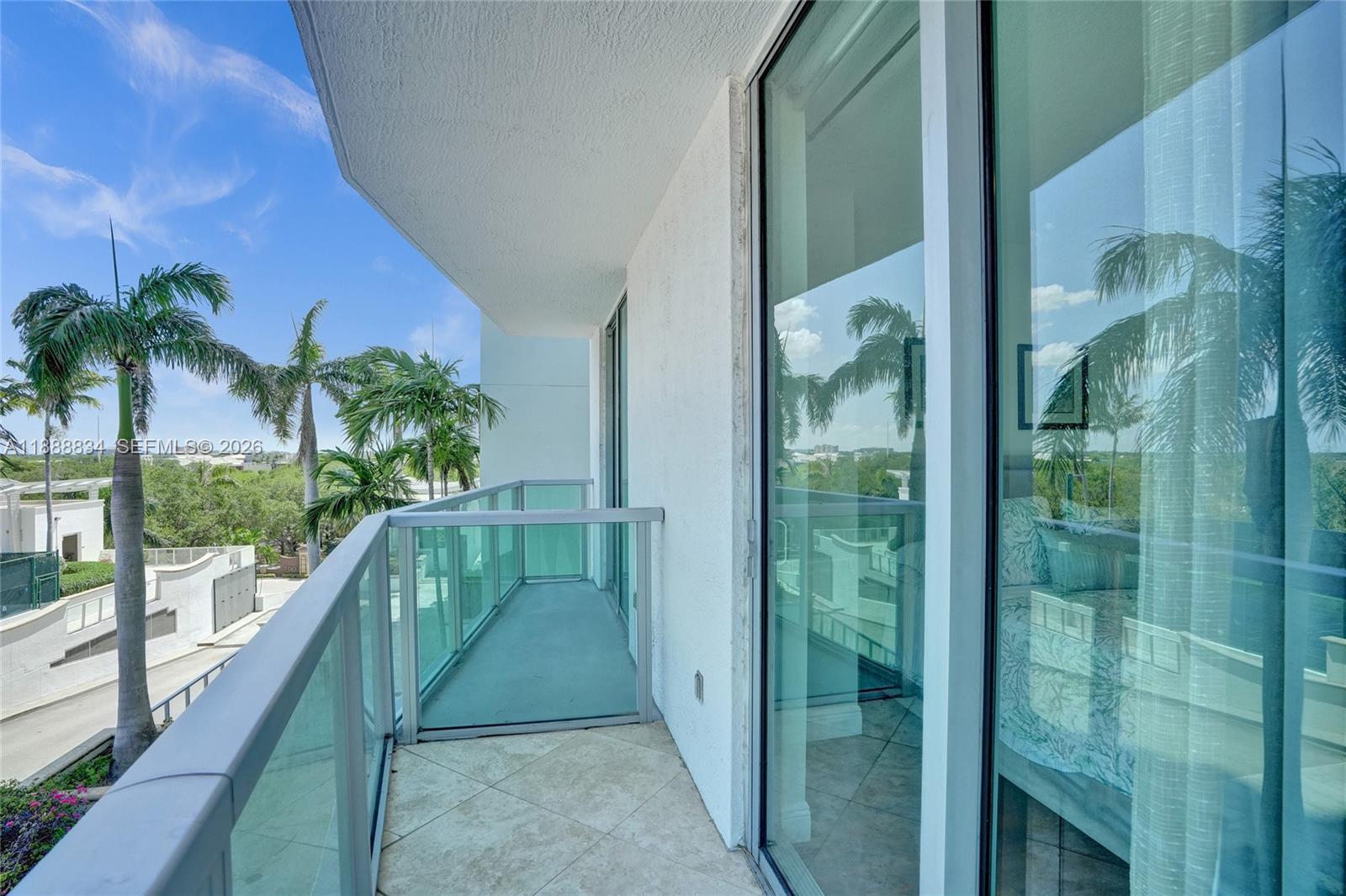 2681 North Flamingo Road, Unit 605S Sunrise, FL 33323 - Photo 43 of 47 a balcony with view of palm tree