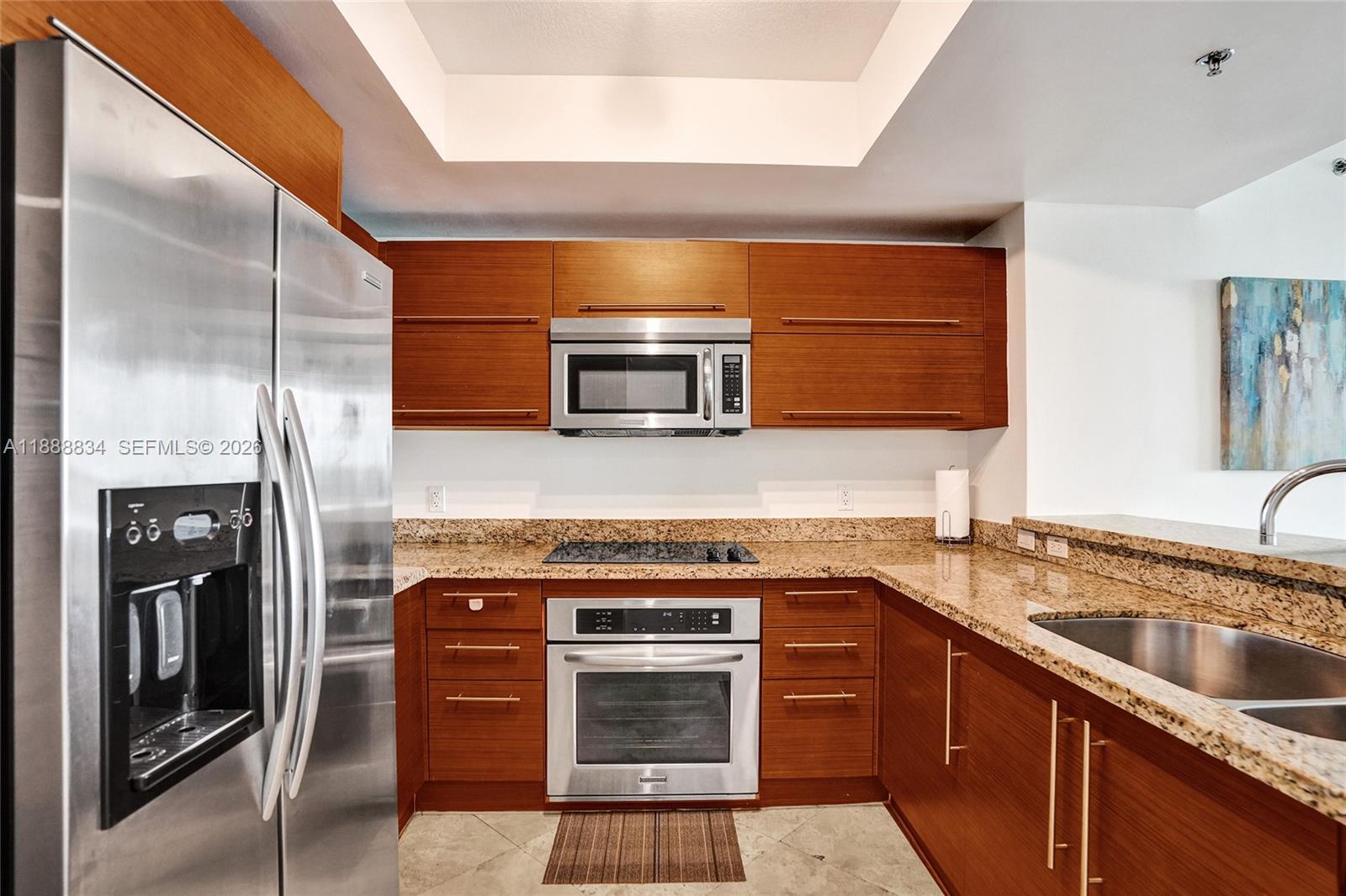 2681 North Flamingo Road, Unit 605S Sunrise, FL 33323 - Photo 10 of 47 a kitchen with a sink stove and refrigerator