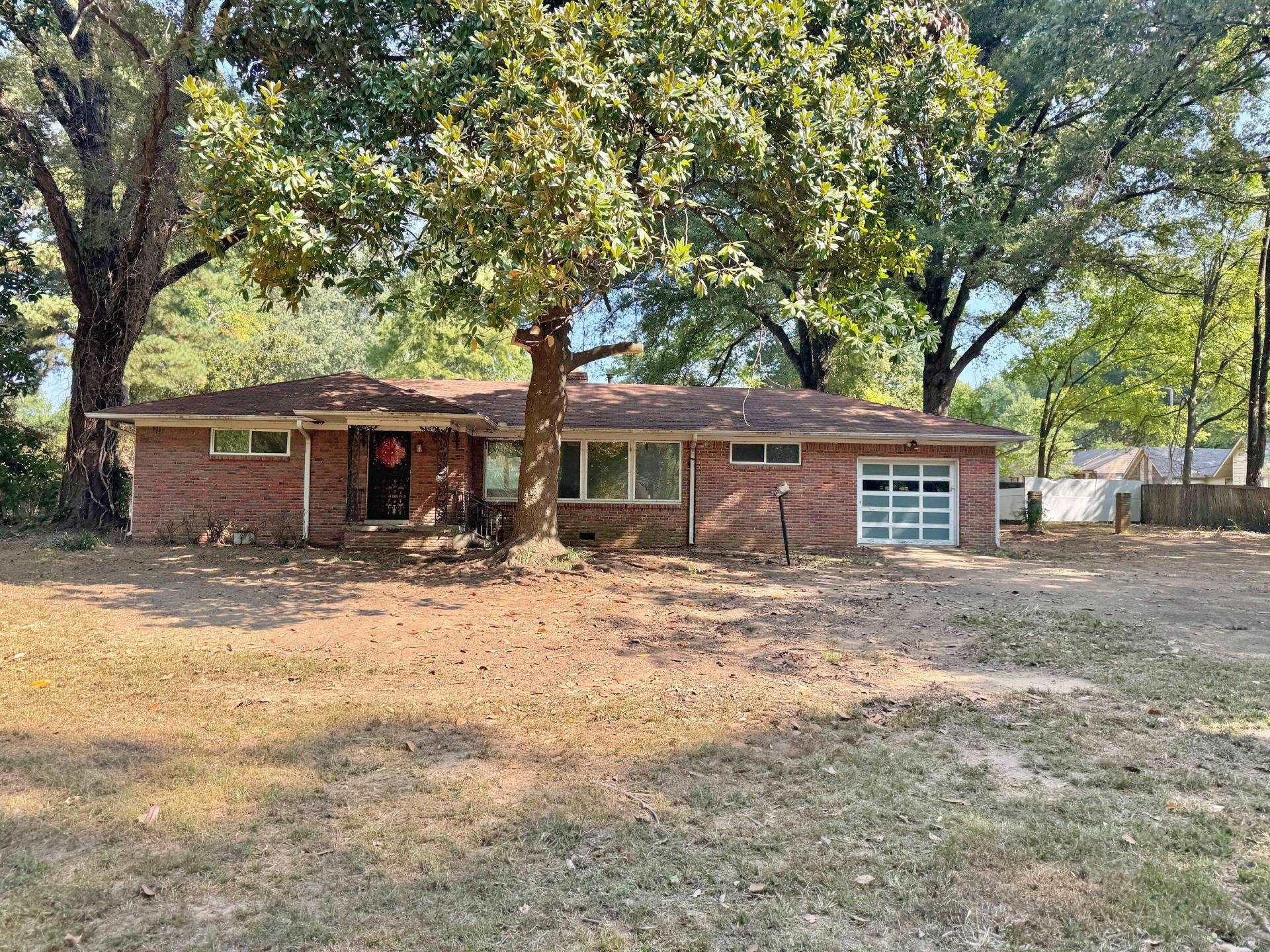 6014 Raleigh Lagrange Road Memphis, TN 38134 - Photo 1 of 19 View of front of home with brick siding and a garage