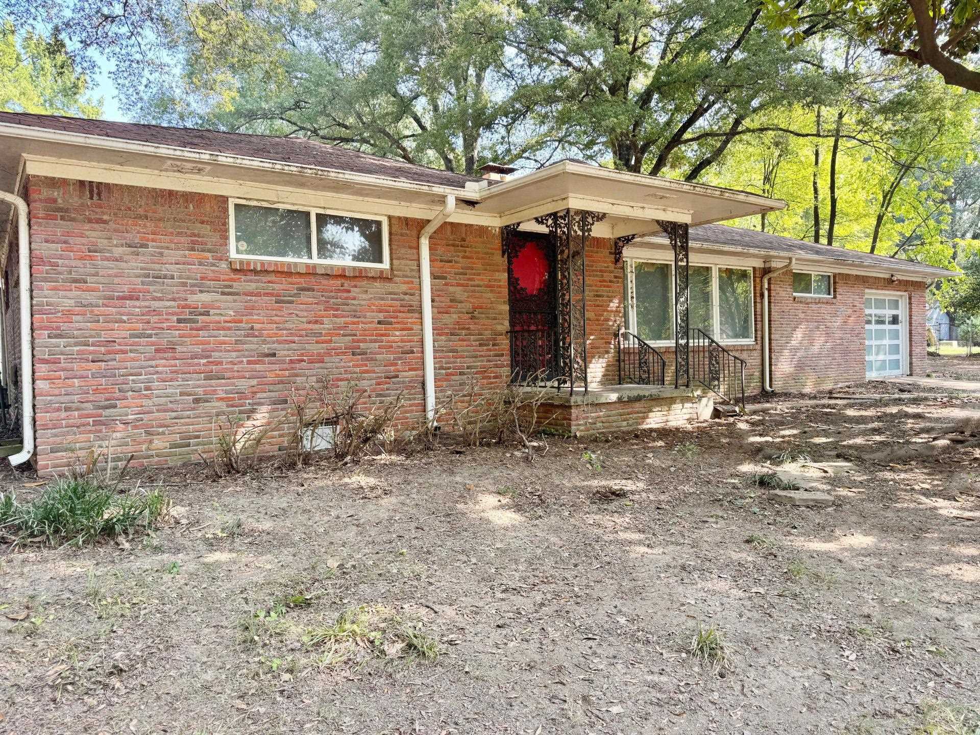6014 Raleigh Lagrange Road Memphis, TN 38134 - Photo 3 of 19 Ranch-style home with a garage, brick siding, and crawl space
