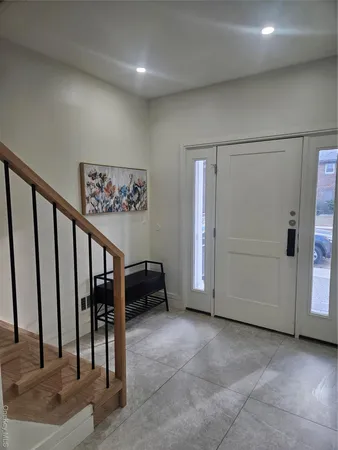 a view of entryway with stairs