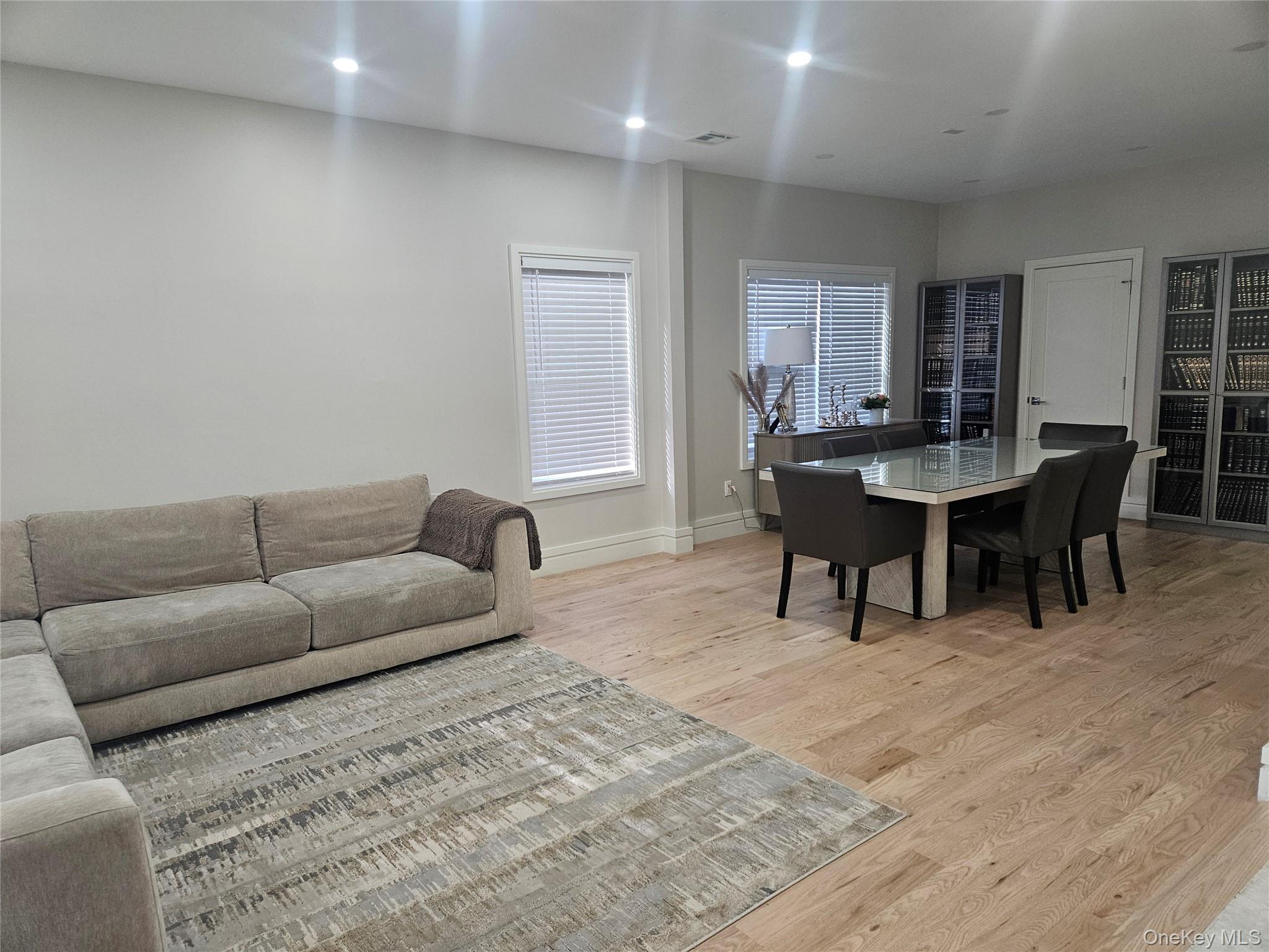 344 Bayview Avenue Inwood, NY 11096 - Photo 3 of 12 a living room with furniture a dining table and a piano table