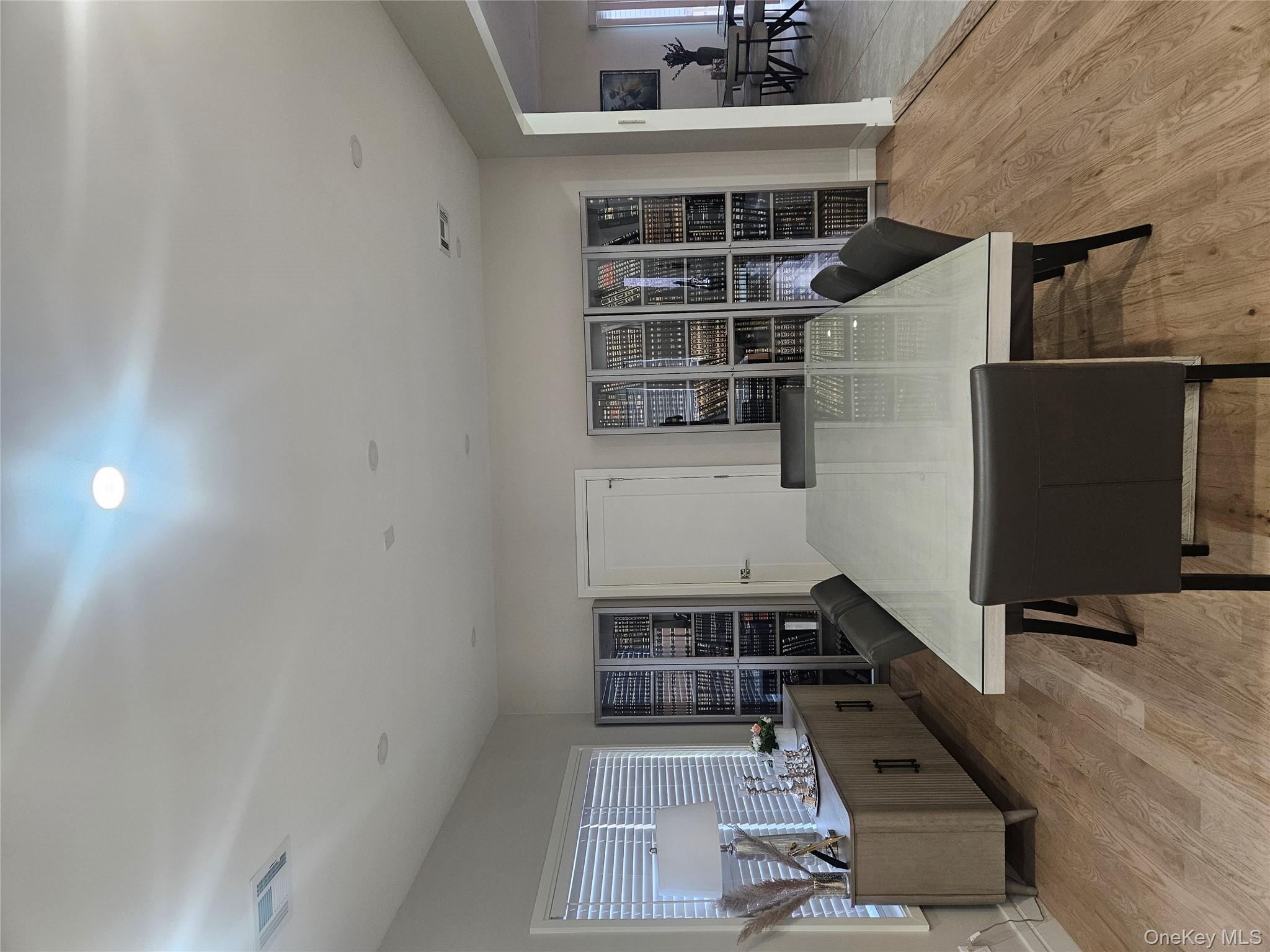 344 Bayview Avenue Inwood, NY 11096 - Photo 4 of 12 a living room with furniture a dining table and chairs with wooden floor