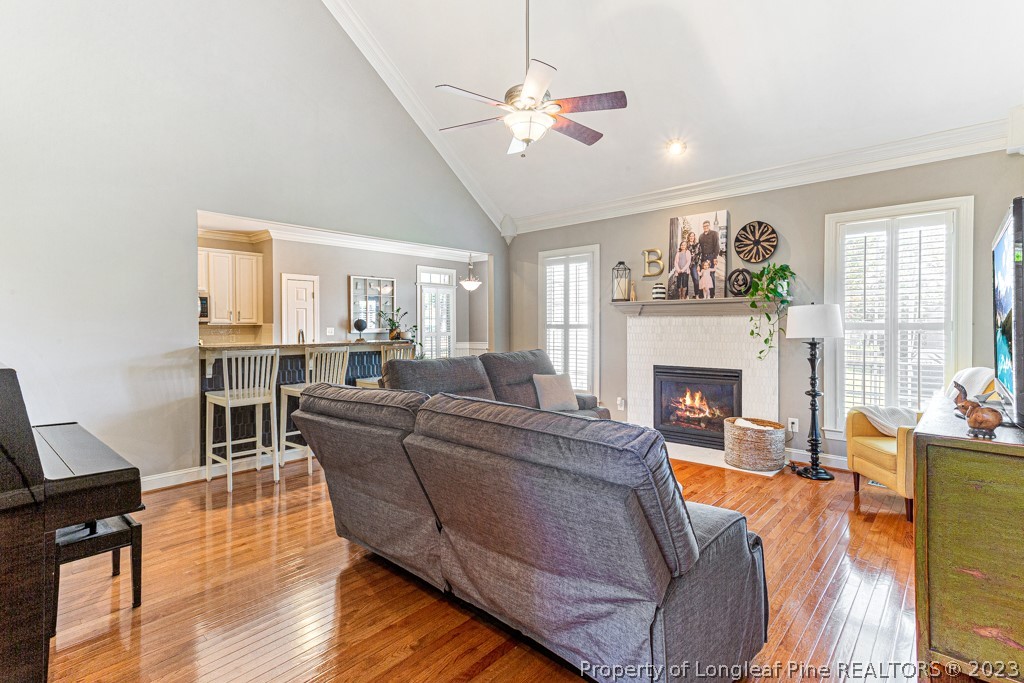 645 Little Bridge Road Fayetteville, NC 28311 - Photo 12 of 49 a living room with furniture a large window and a fireplace