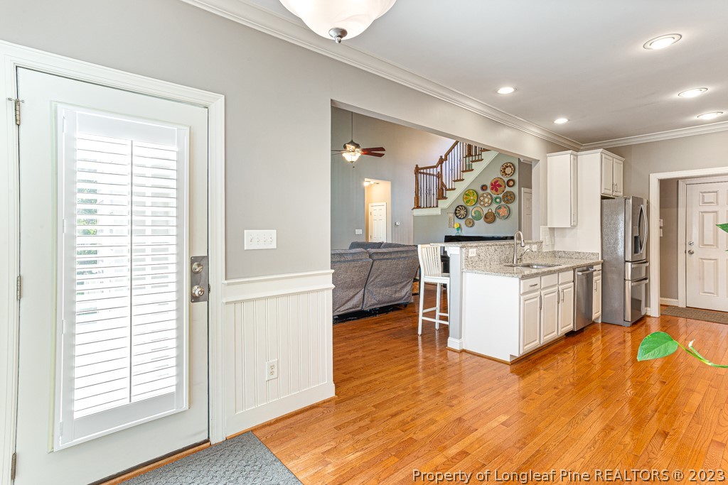 645 Little Bridge Road Fayetteville, NC 28311 - Photo 16 of 49 a kitchen with a refrigerator and a stove top oven