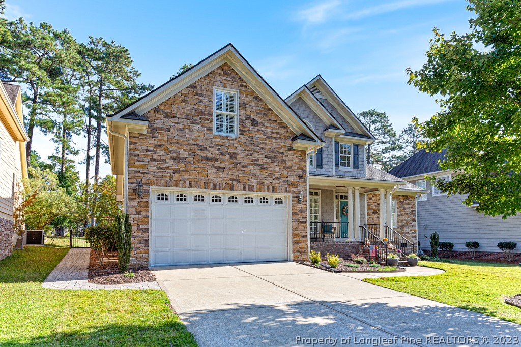 645 Little Bridge Road Fayetteville, NC 28311 - Photo 2 of 49 a front view of a house with yard and glass windows