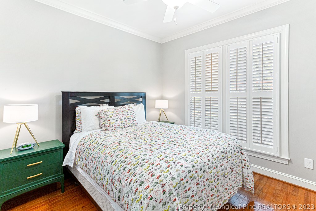 645 Little Bridge Road Fayetteville, NC 28311 - Photo 22 of 49 a bedroom with a bed and a night stand