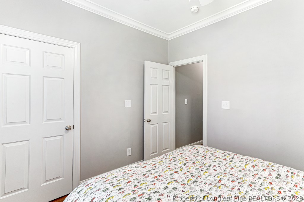 645 Little Bridge Road Fayetteville, NC 28311 - Photo 23 of 49 a bedroom with a bed and a window